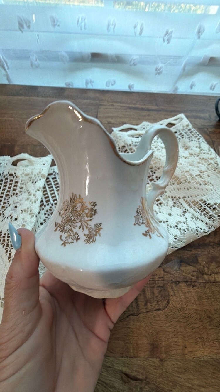 #77 This is an early 20th-century Homer Laughlin semi-vitreous ceramic pitcher i